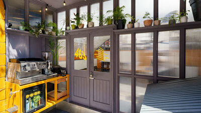 "Stylish coffee corner at Railway Arch 463, Hackney for networking events with vibrant decor."