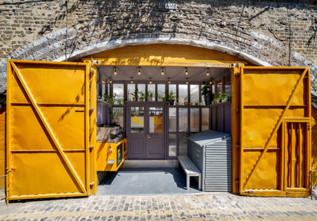 Vibrant repurposed shipping container venue in Hackney for creative events and workshops.