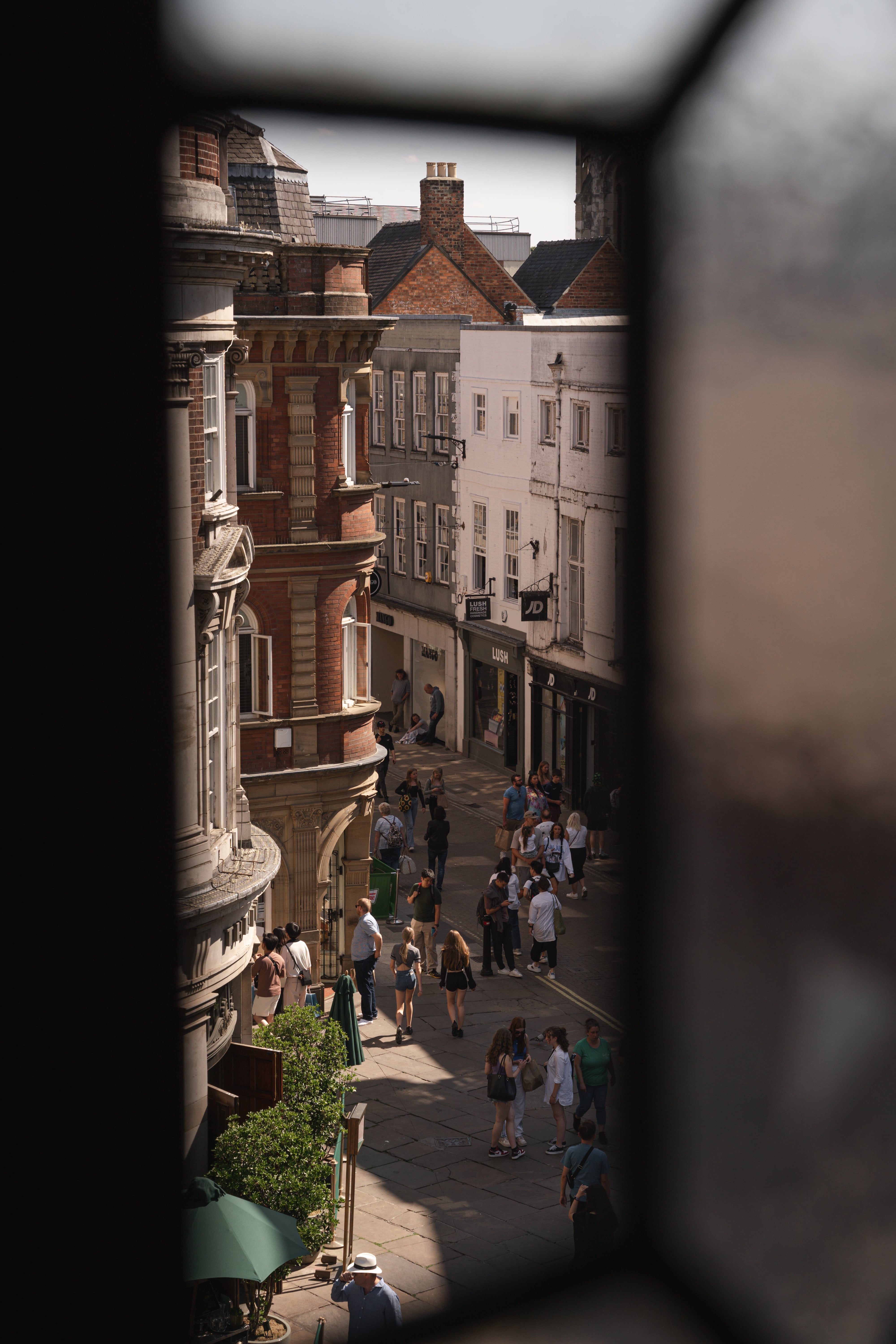 Vibrant street scene at Whiskey in Impossible York, ideal for outdoor networking events.