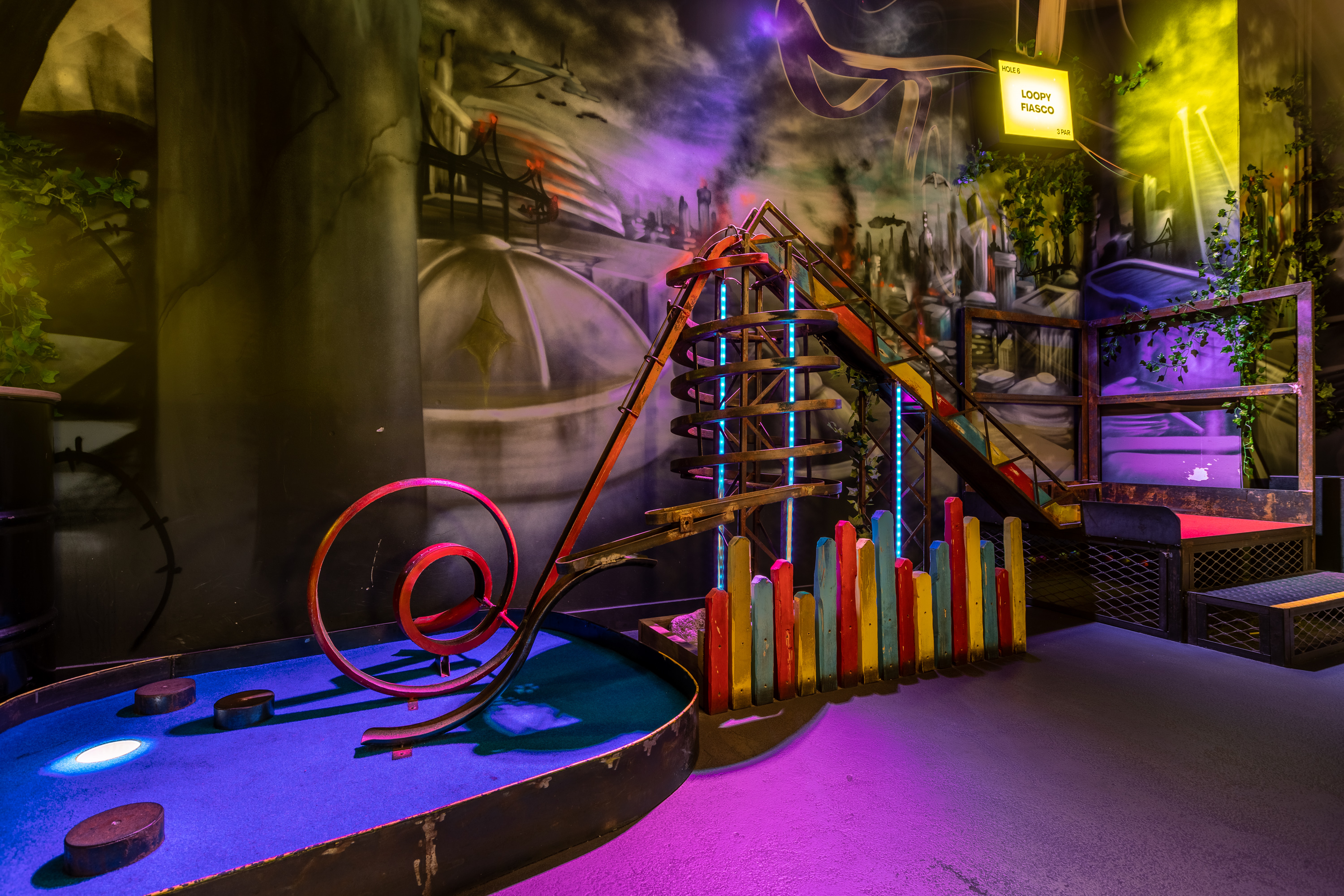 Bozo at Junkyard Golf Club, vibrant mini-golf for team-building and networking events.