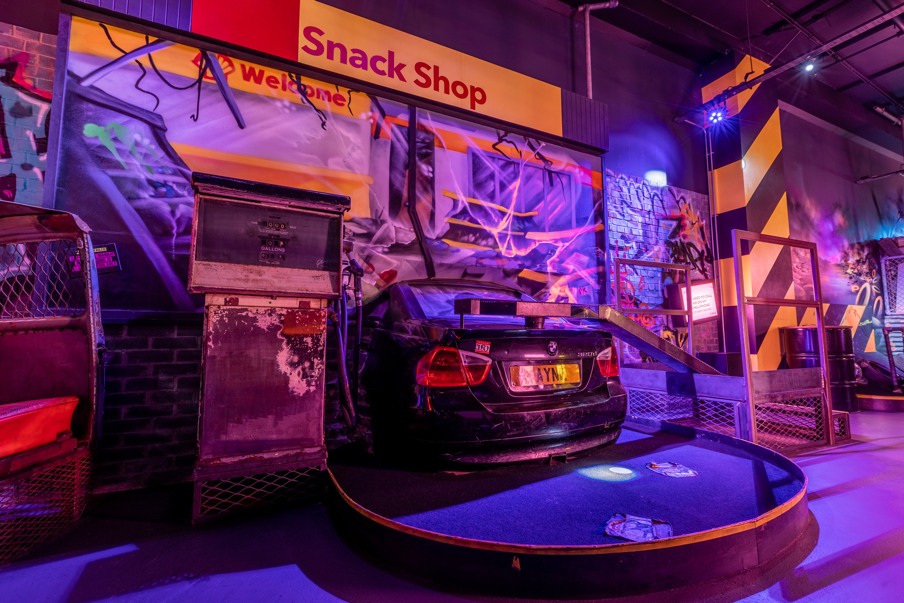 Gary at Junkyard Golf Club with colorful car decor, ideal for themed events and gatherings.