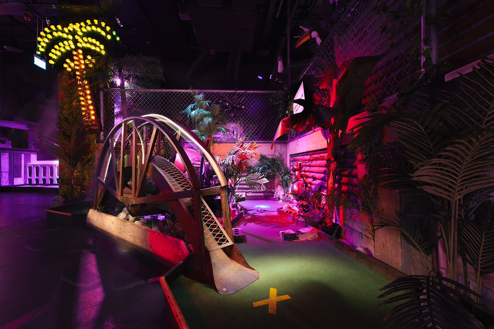 Pablo at Junkyard Golf Club's vibrant mini-golf for team-building events.
