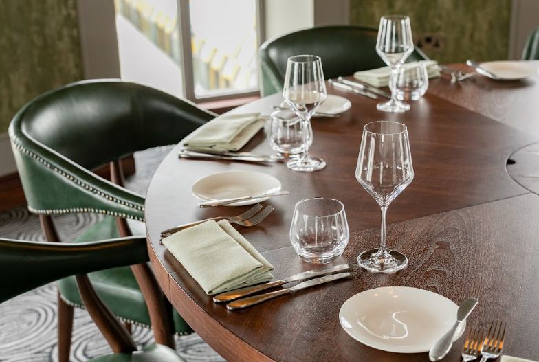 Elegant round dining table setup for upscale events in Wagtail London.