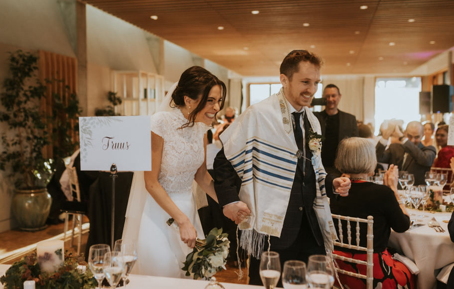 Wedding reception in Soane's Garden Room with elegant decor and joyful newlyweds.
