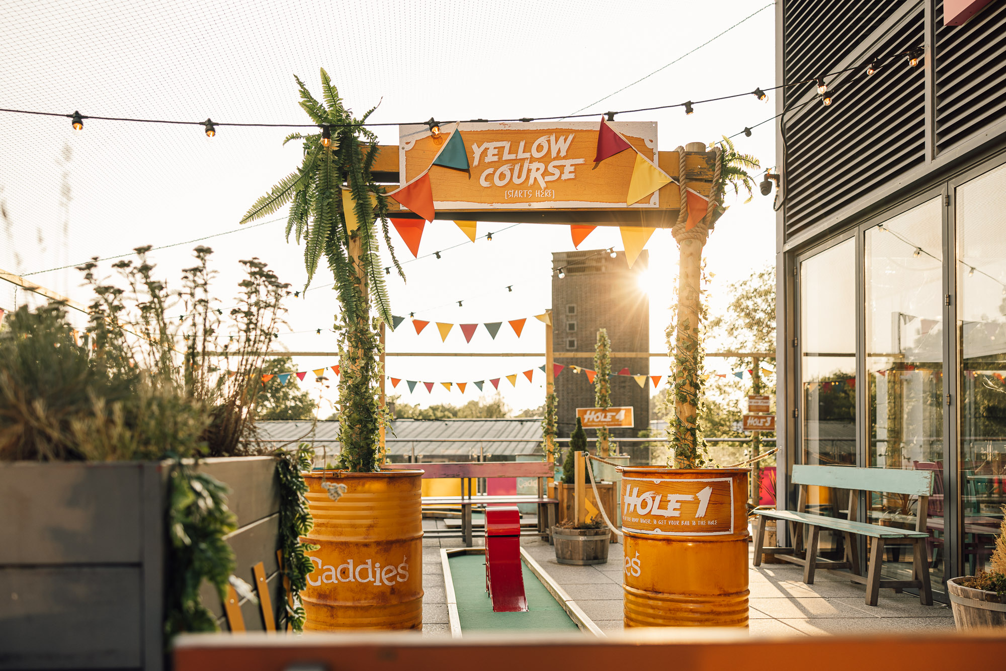 Vibrant outdoor event space at Caddies Crawley with colorful decor for gatherings.
