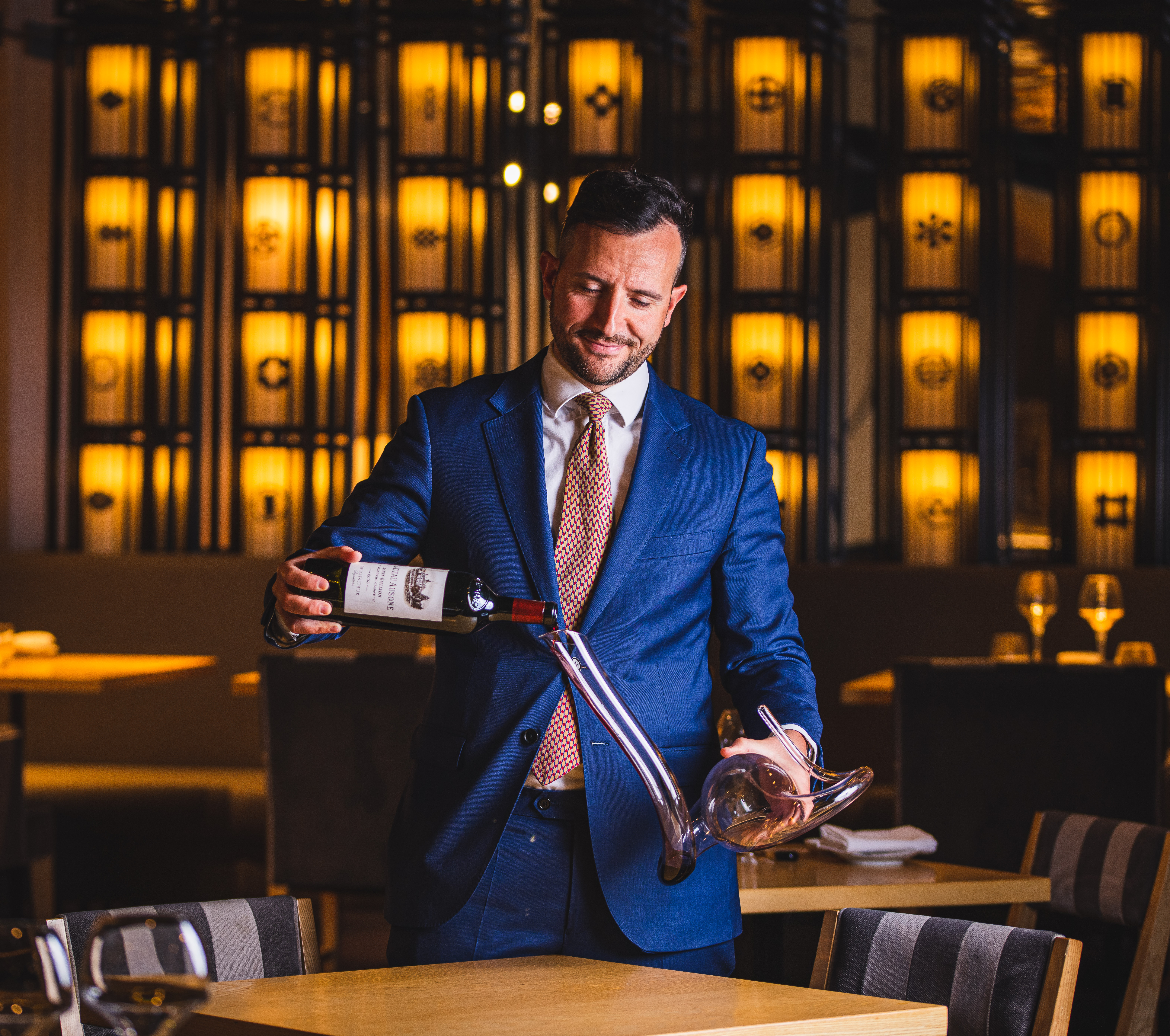 Event professional pouring wine at upscale Cocktail Bar in Ginza, perfect for corporate gatherings.