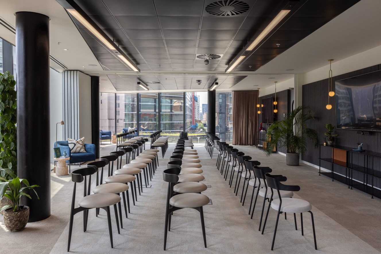 Modern event space with sleek seating for corporate meetings at x+why 100 Embankment.