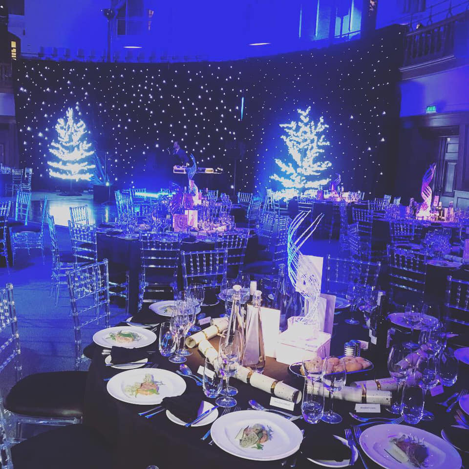 Elegant Christmas gala at Church House Westminster with festive decor and fine dining.