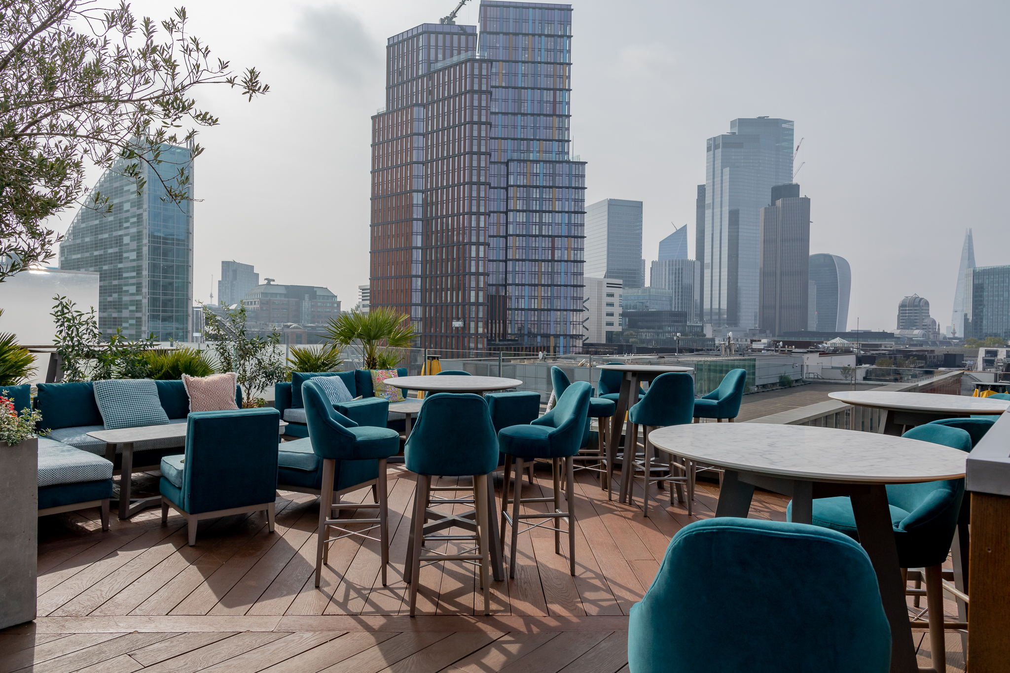 Stylish rooftop venue with urban skyline, perfect for events and gatherings.