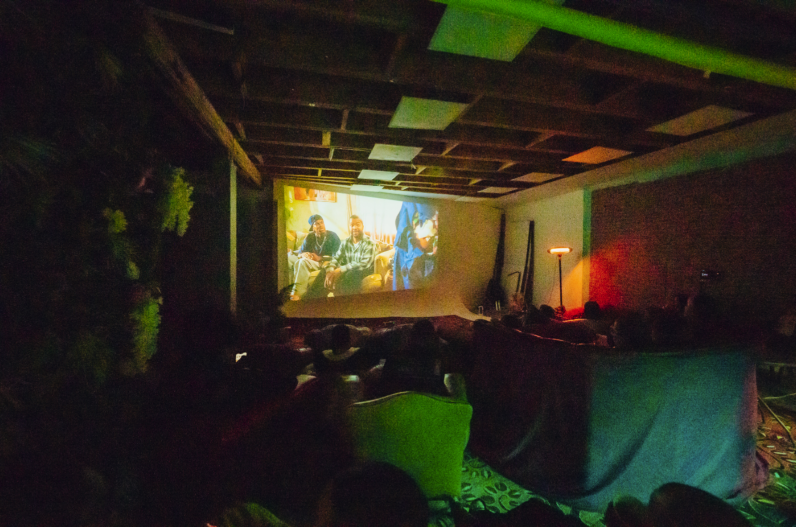 Cozy film screening venue with relaxed audience and creative decor at 6 Degrees Studios.