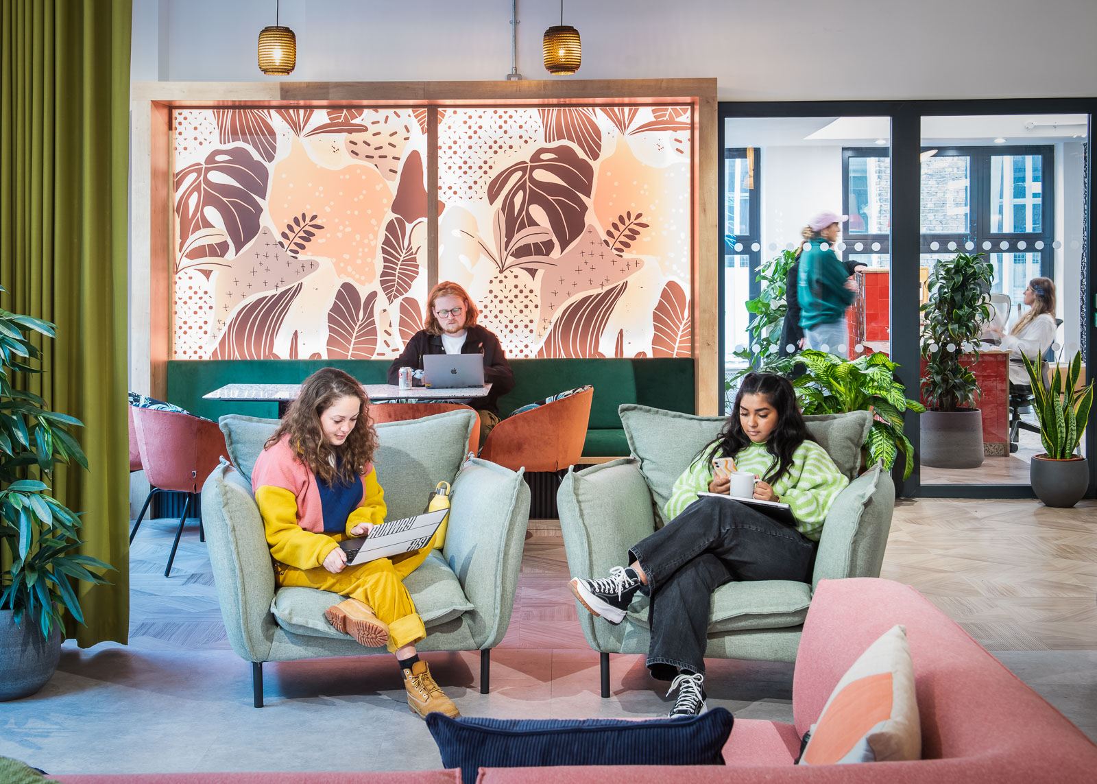 Vibrant modern workspace with greenery, ideal for networking events and collaboration.