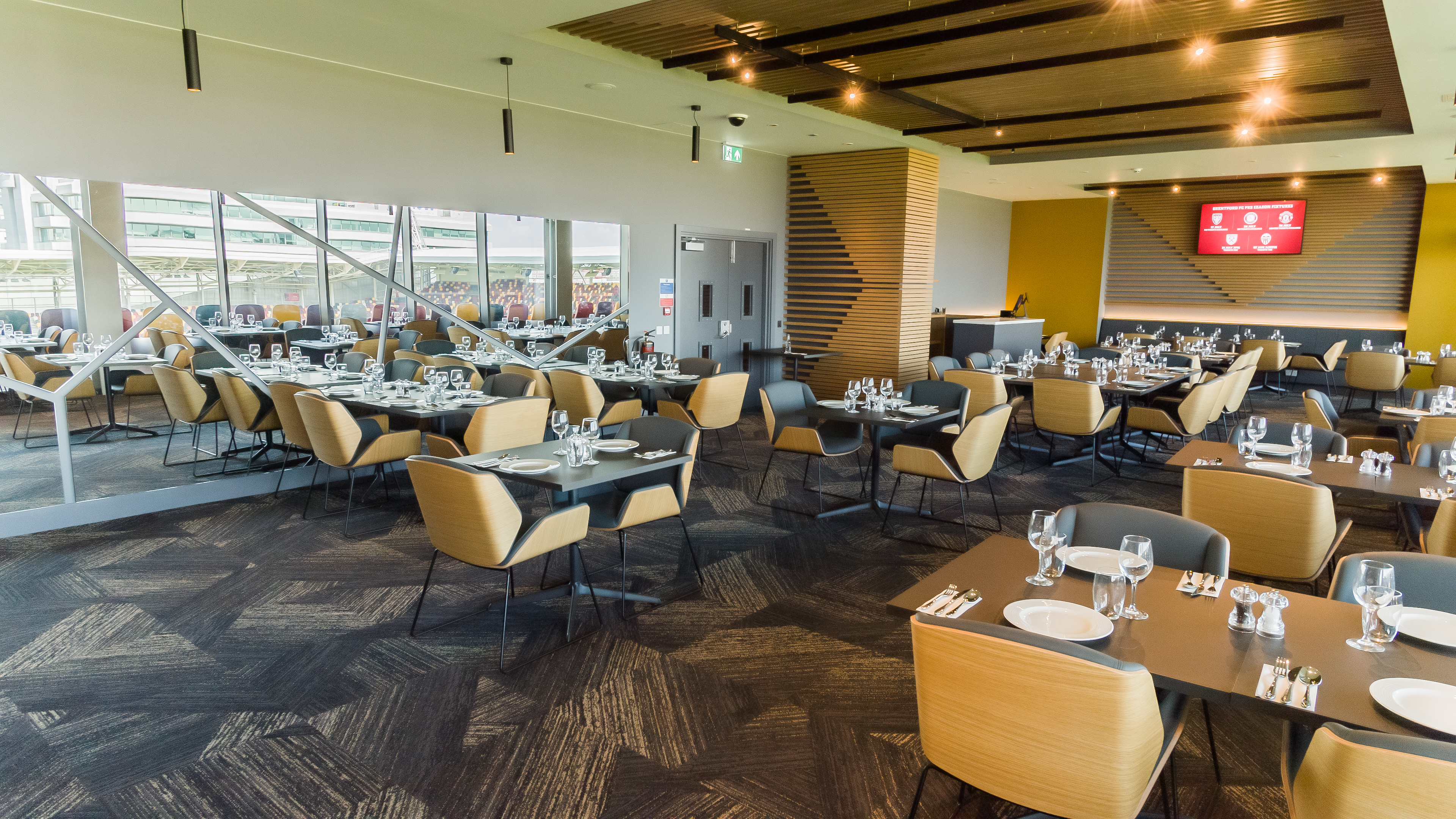 Modern dining space at Brentford FC for corporate events with elegant seating.