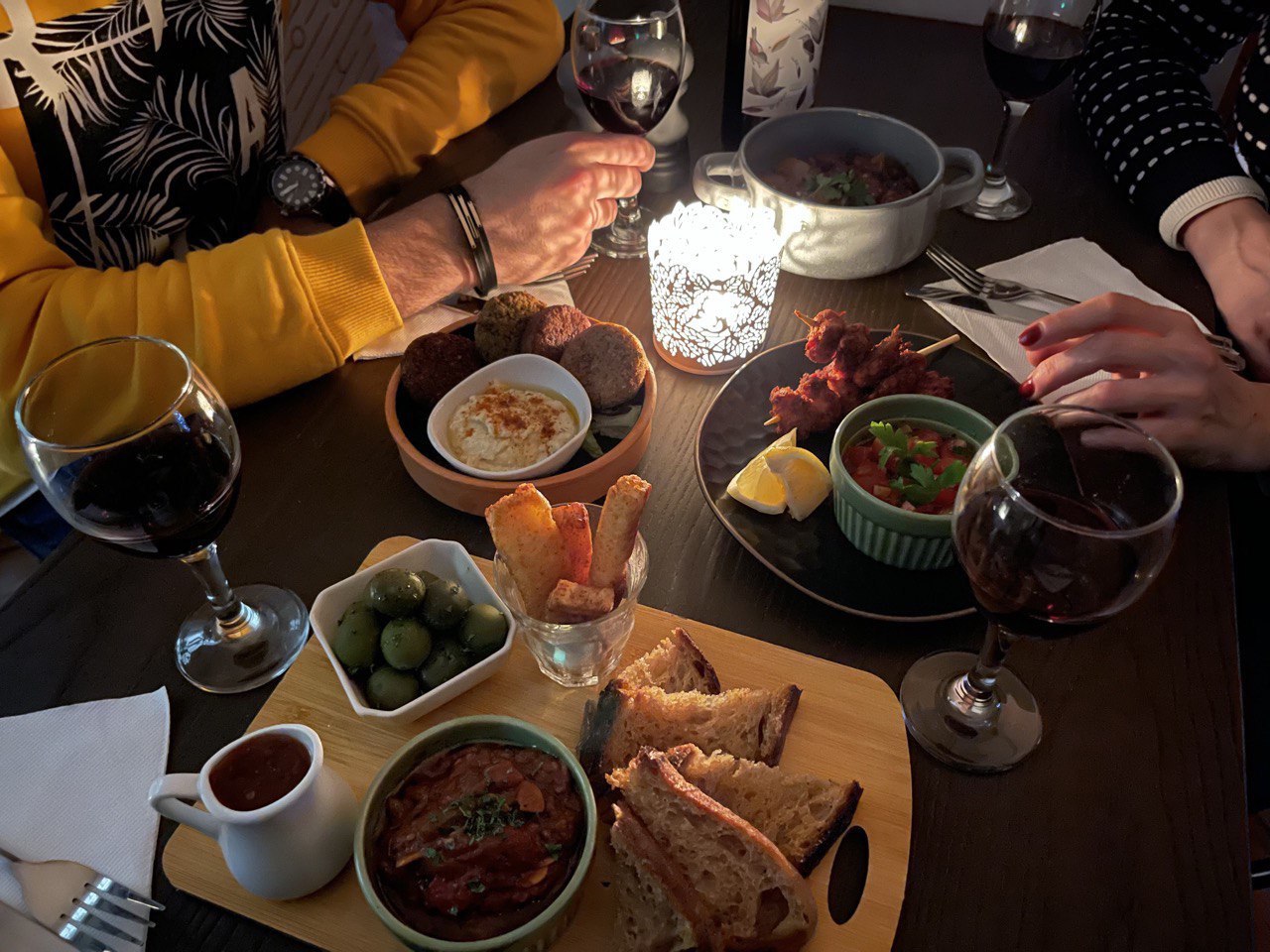 Intimate dining setup at Geo Art Cafe with appetizers, ideal for networking events.