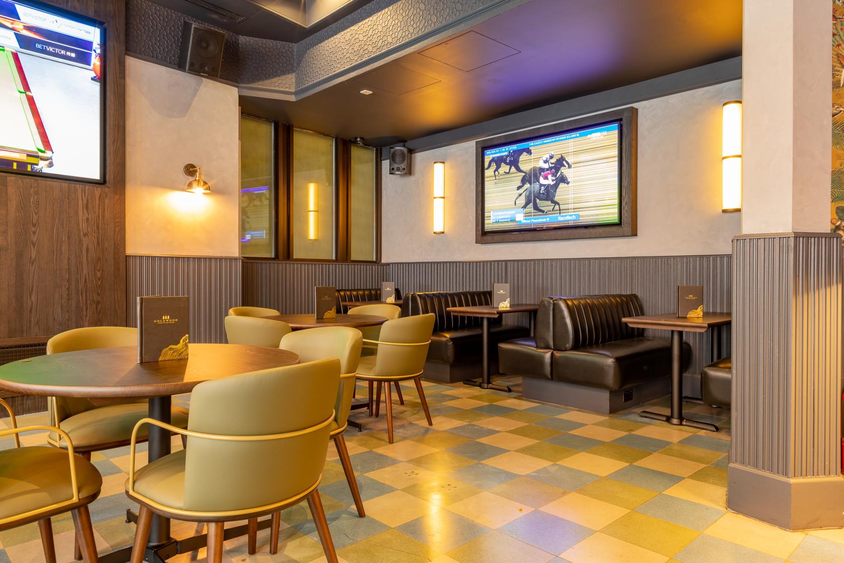 Oval Bar at Goldwood Spots Pub, modern decor, ideal for casual gatherings and events.