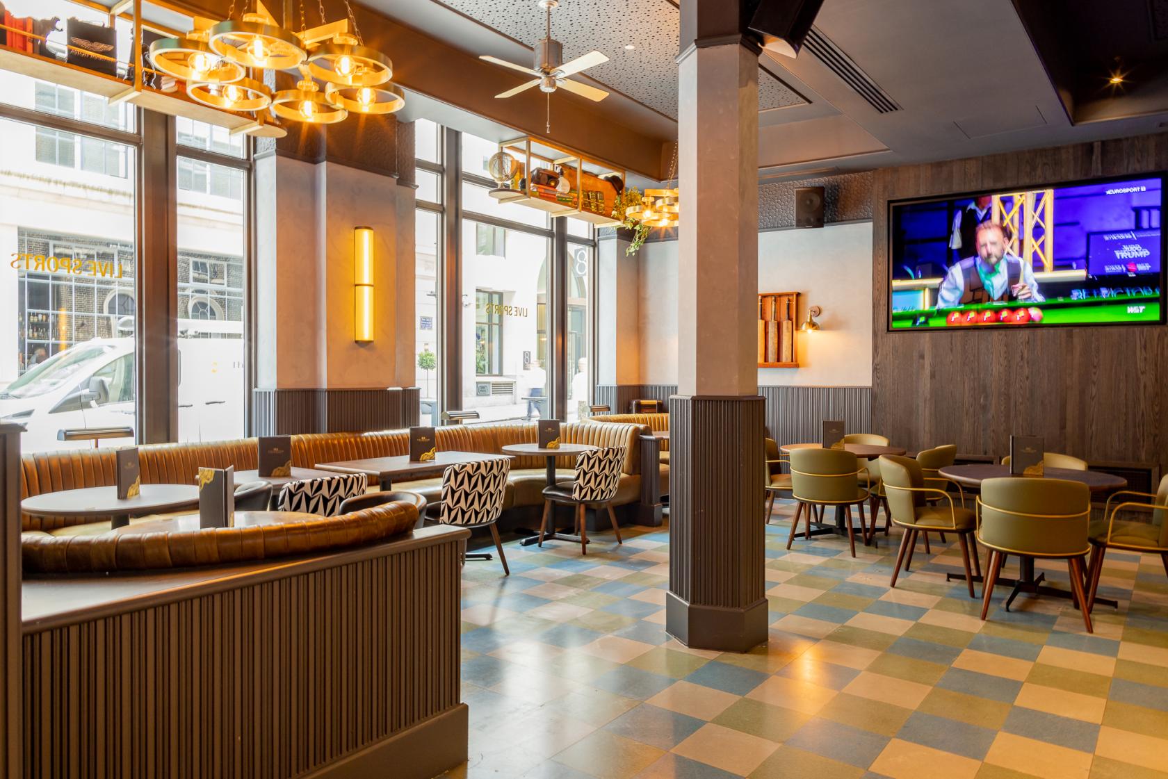 Modern Oval Bar in Goldwood Spots Pub, ideal for corporate events and meetings.