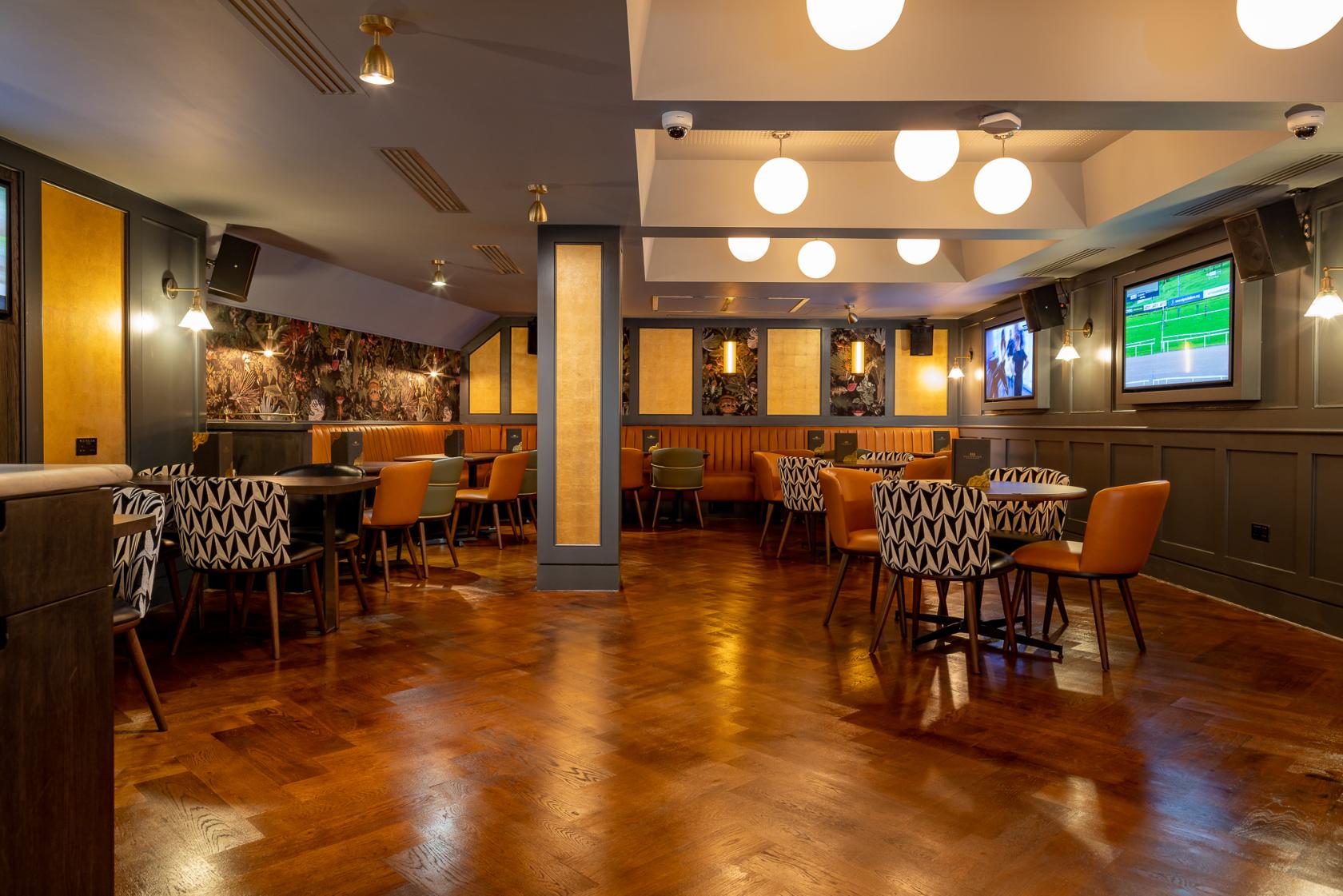 Modern Mezzanine event space at Goldwood Spots Pub, ideal for networking and presentations.