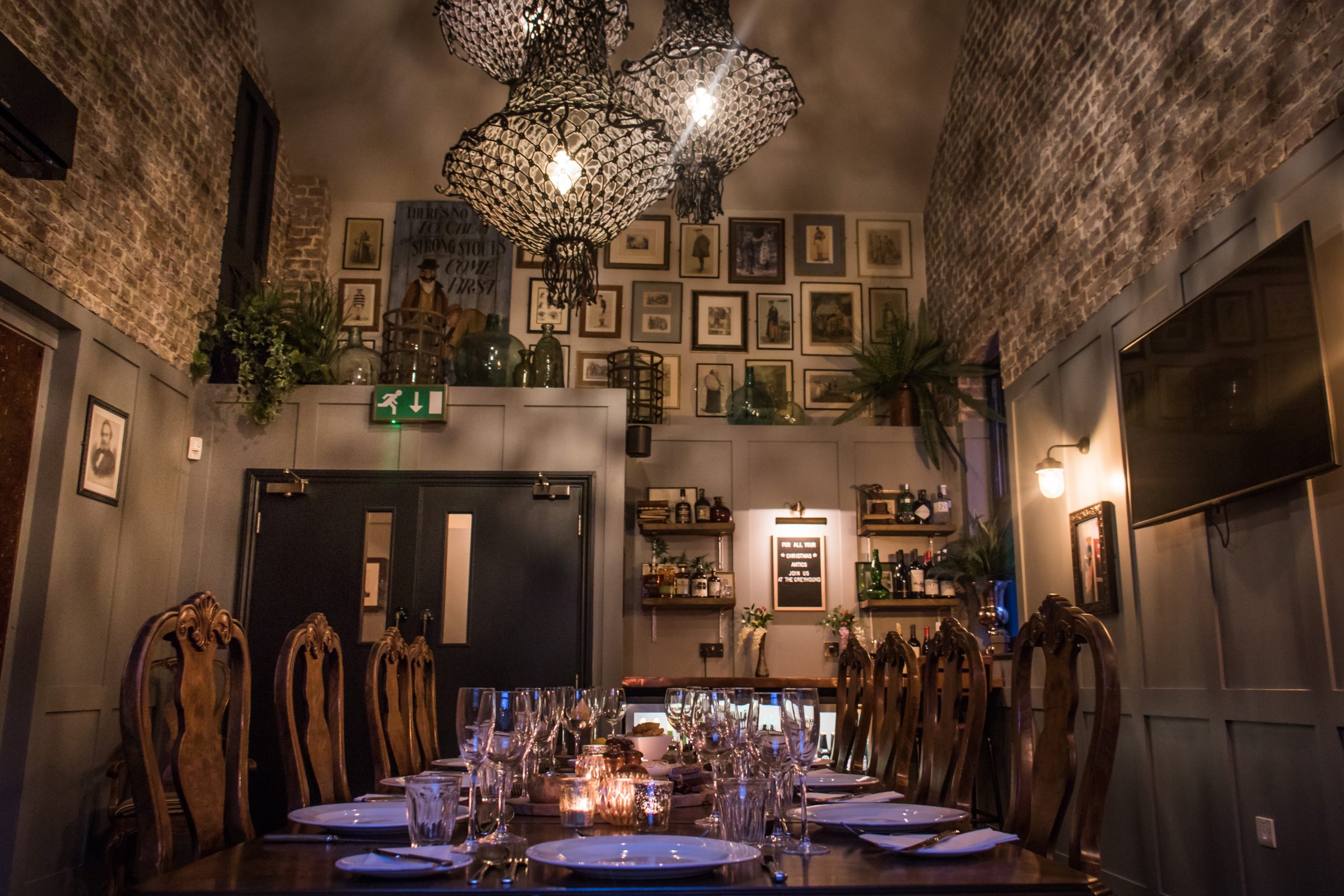 Intimate dining room with chandelier for private events and corporate dinners.