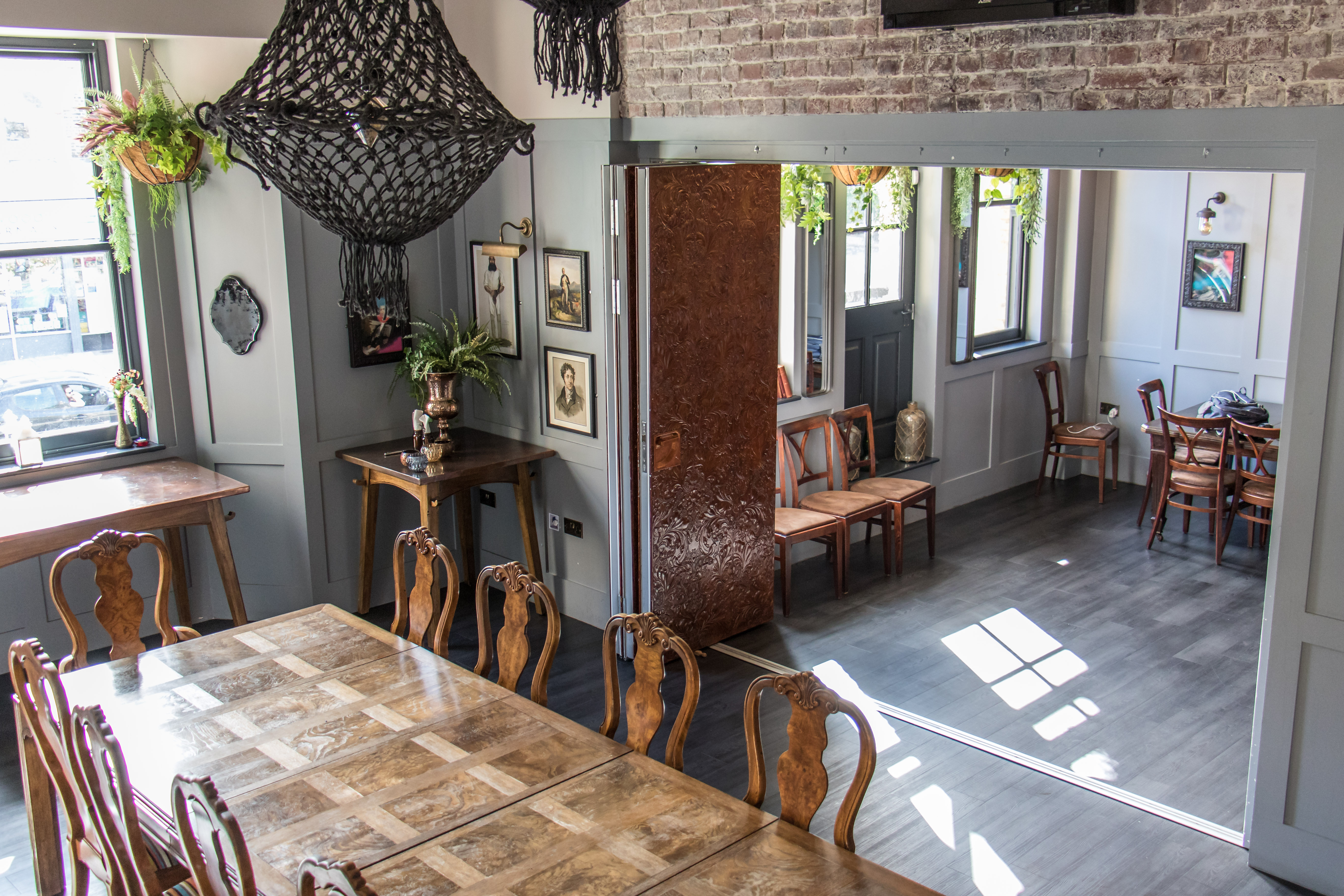 Stylish Greyhound Private Function Room with large wooden table for events and meetings.