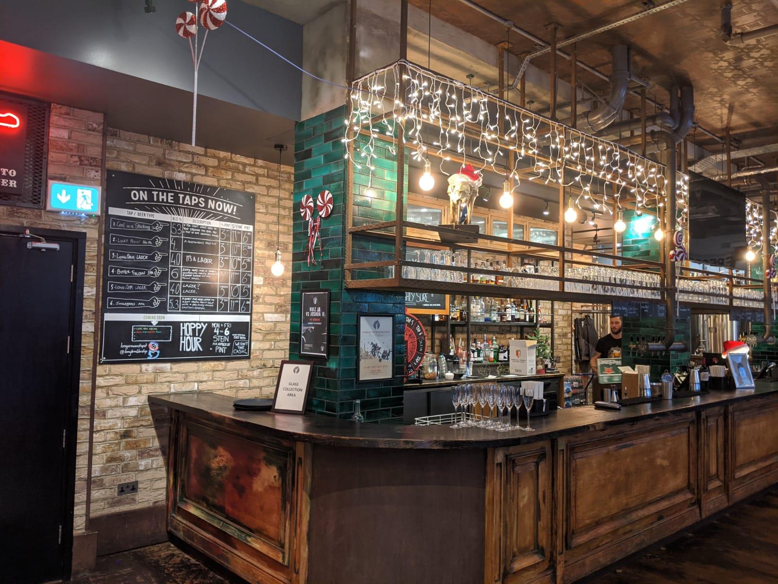 "Stylish bar area at Long Arm Brewery for informal meetings and networking events."