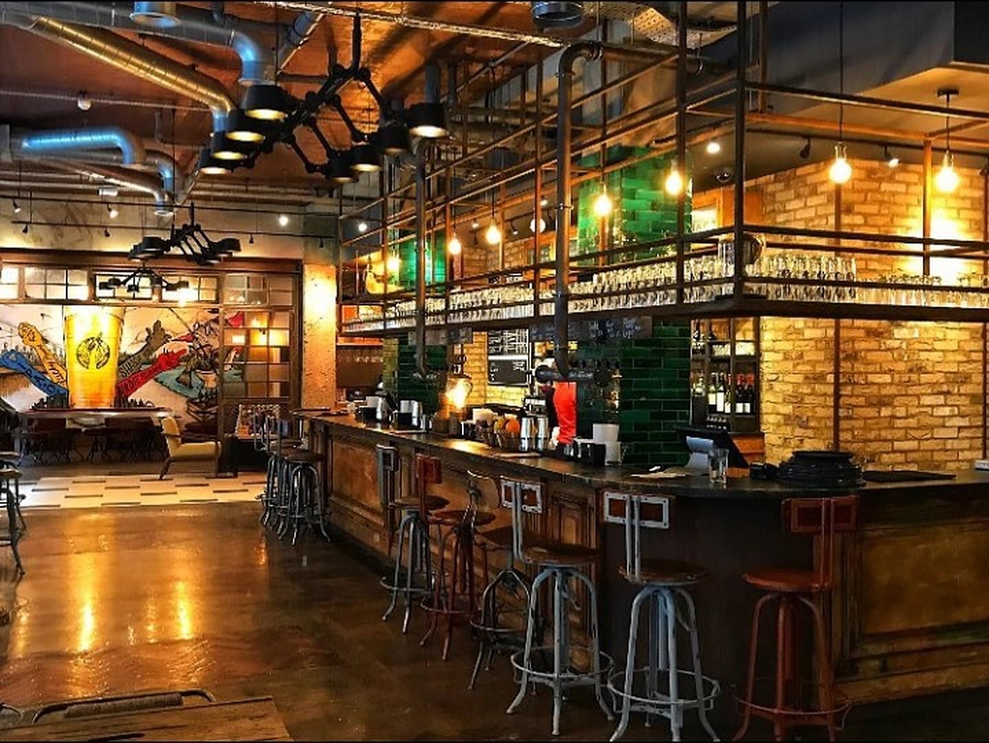 Whole venue hire at Long Arm Brewery, featuring stylish bar and inviting atmosphere for events.