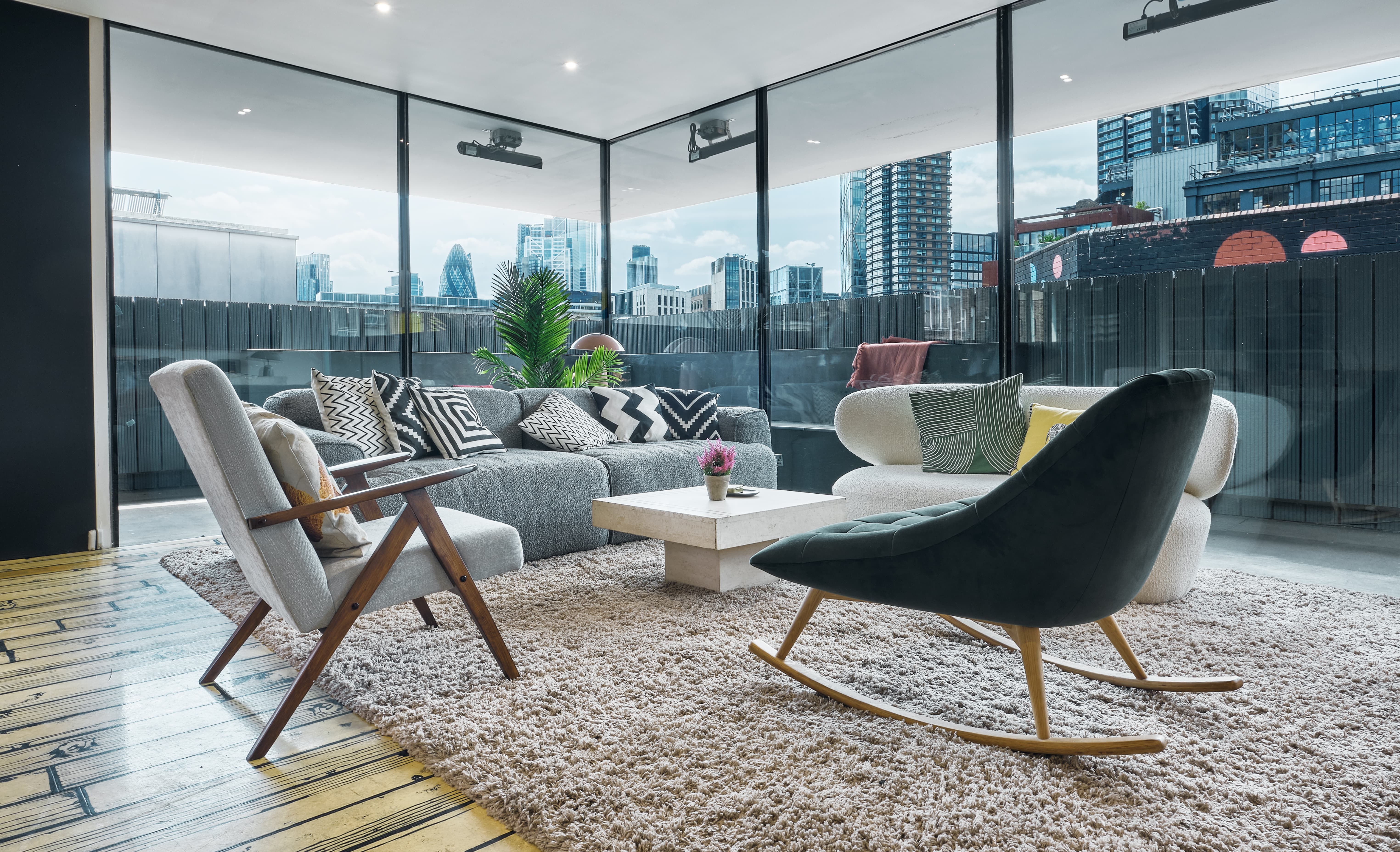 Modern lounge with large windows, ideal for networking events and informal meetings.