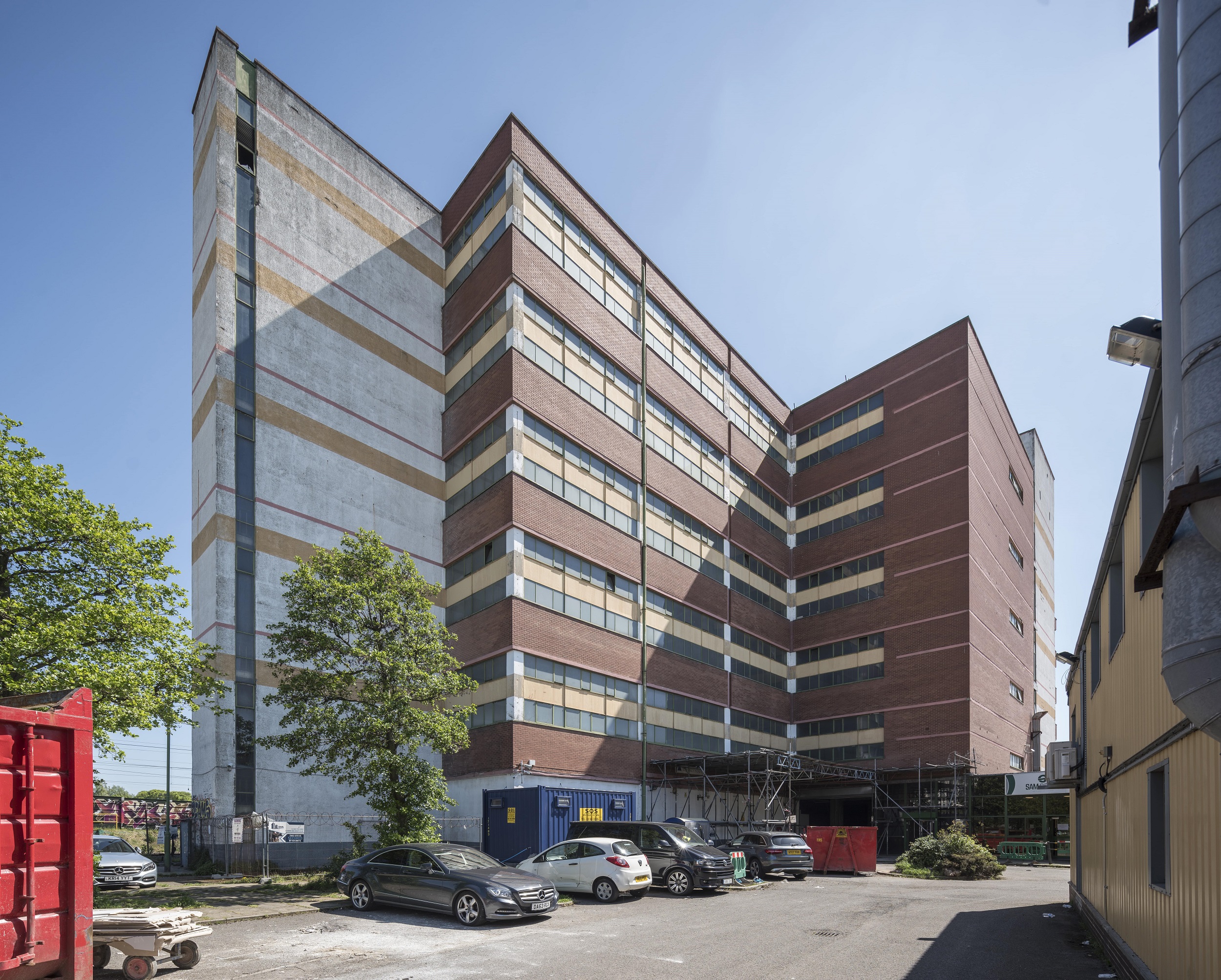 Modern warehouse event space with natural light, ideal for corporate and social gatherings.