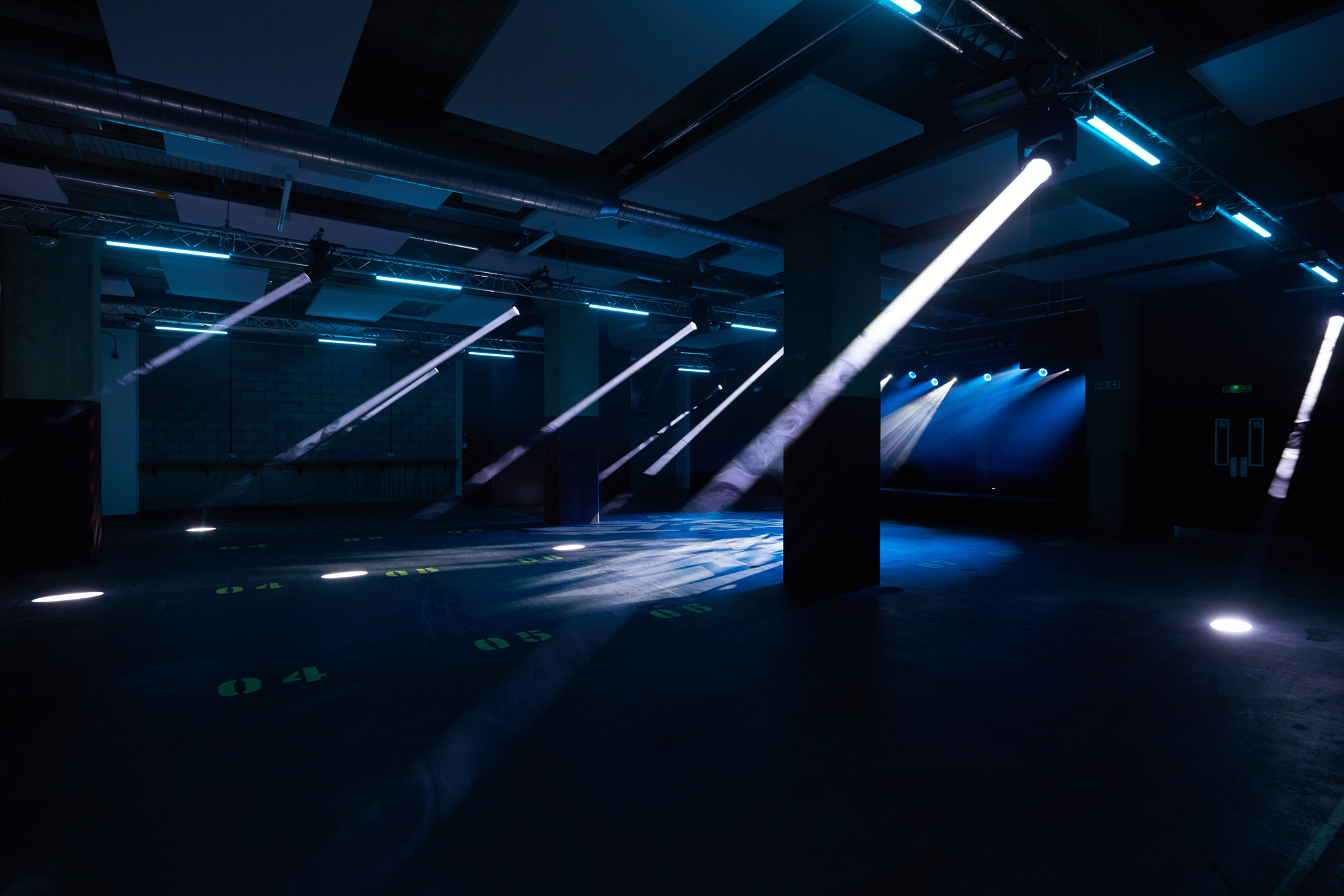 Ground Floor Warehouse Event Space with dramatic lighting for corporate and creative events.