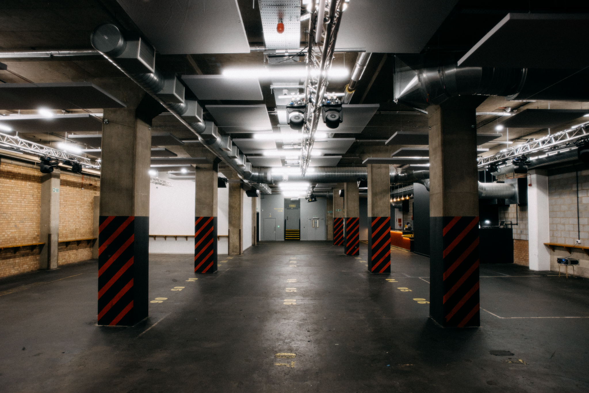 Ground Floor Warehouse Event Space with exposed concrete pillars for corporate and creative events.