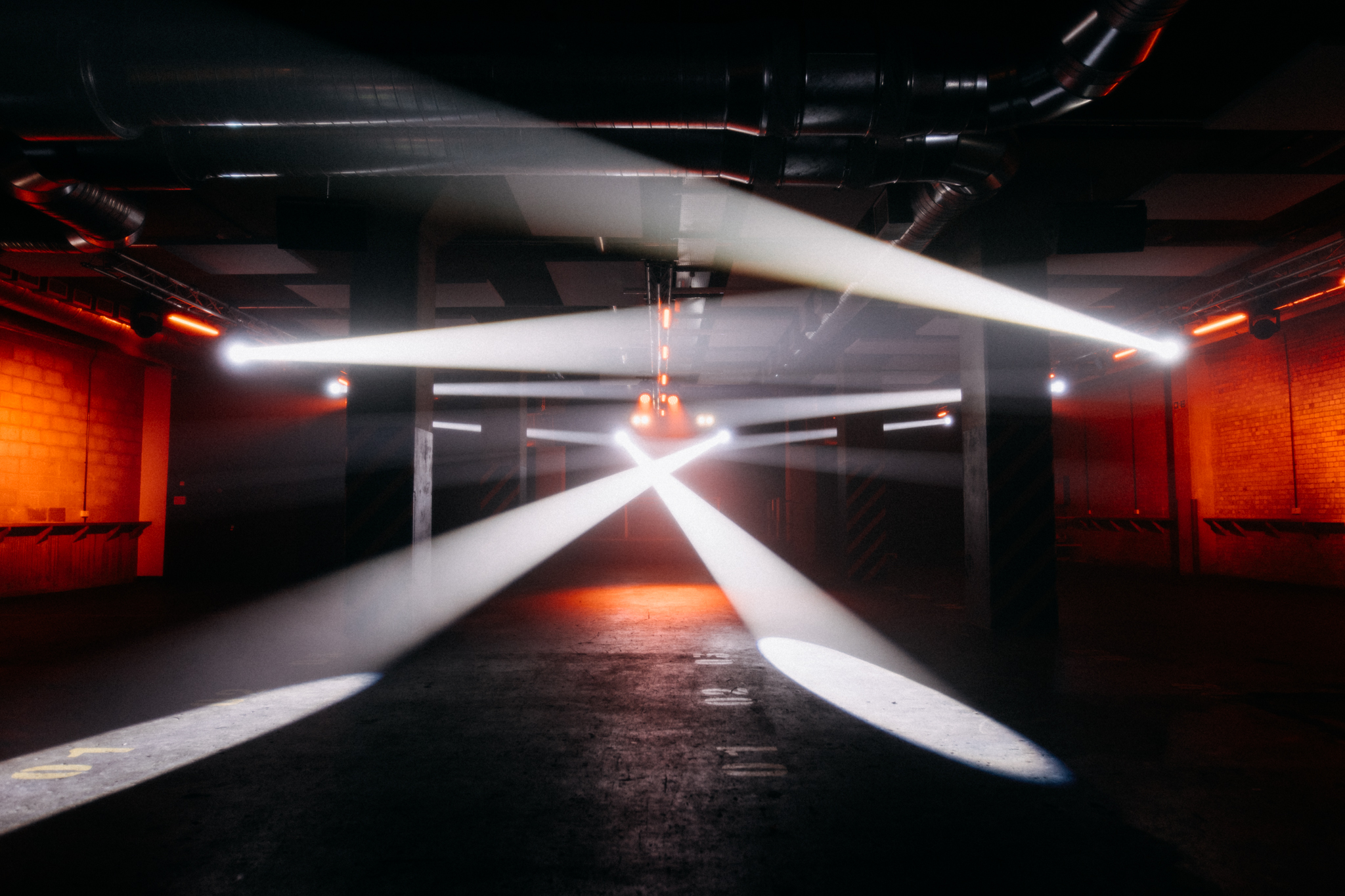 Ground Floor Warehouse Event Space with dramatic lighting for corporate events and parties.