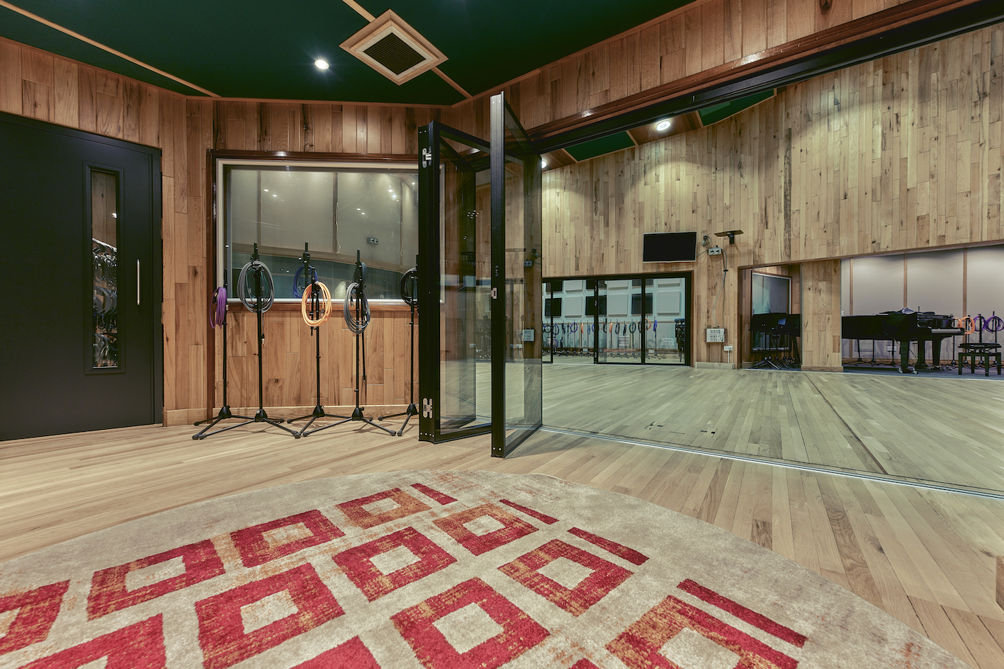 Spacious Angel Studios event space with wooden accents, ideal for workshops and presentations.