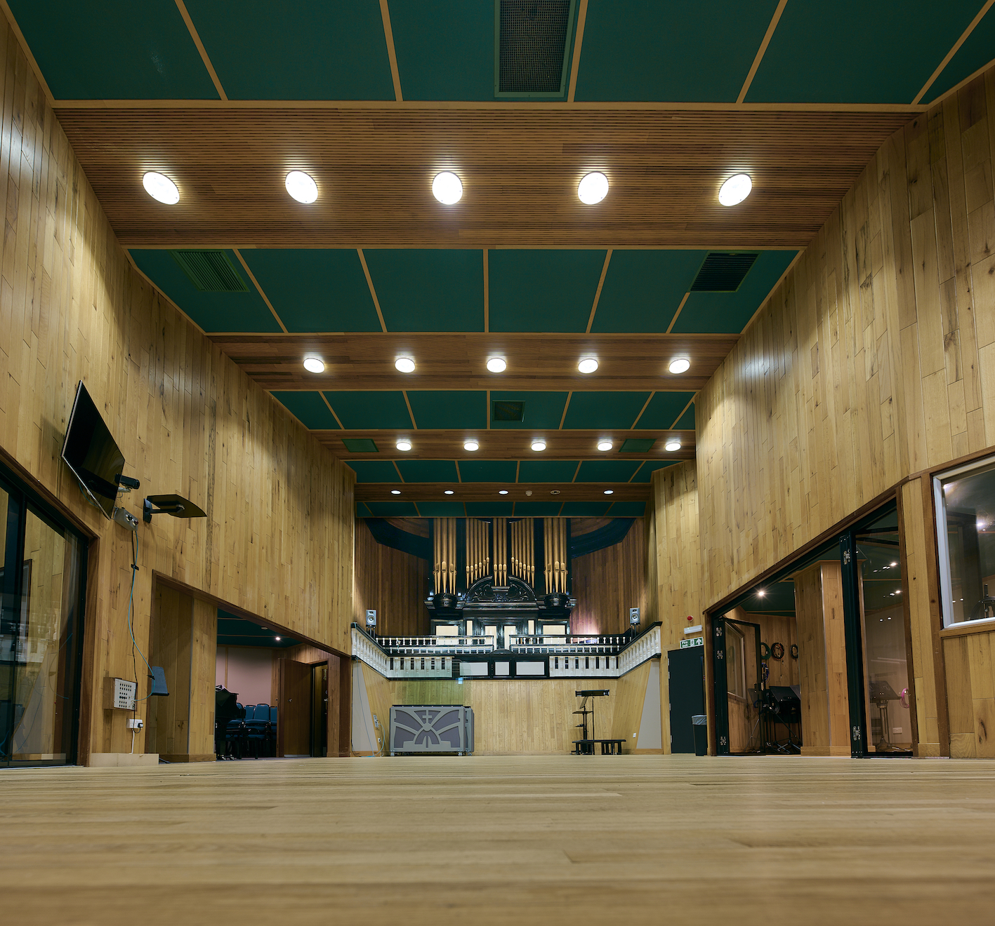 Spacious Angel Studios venue with wooden walls, ideal for events and performances.