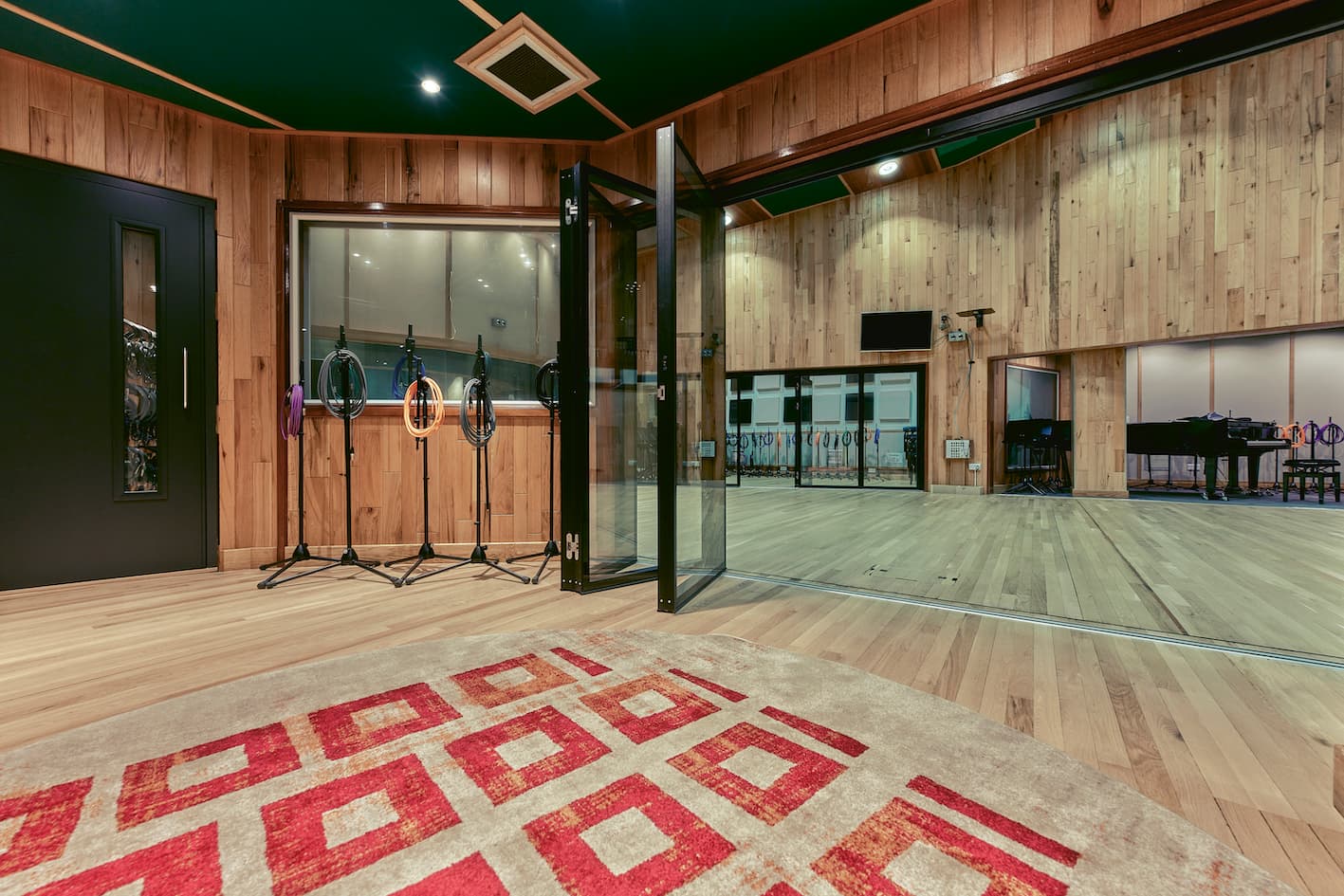 Spacious Angel Studios event space with wooden accents, ideal for workshops and meetings.