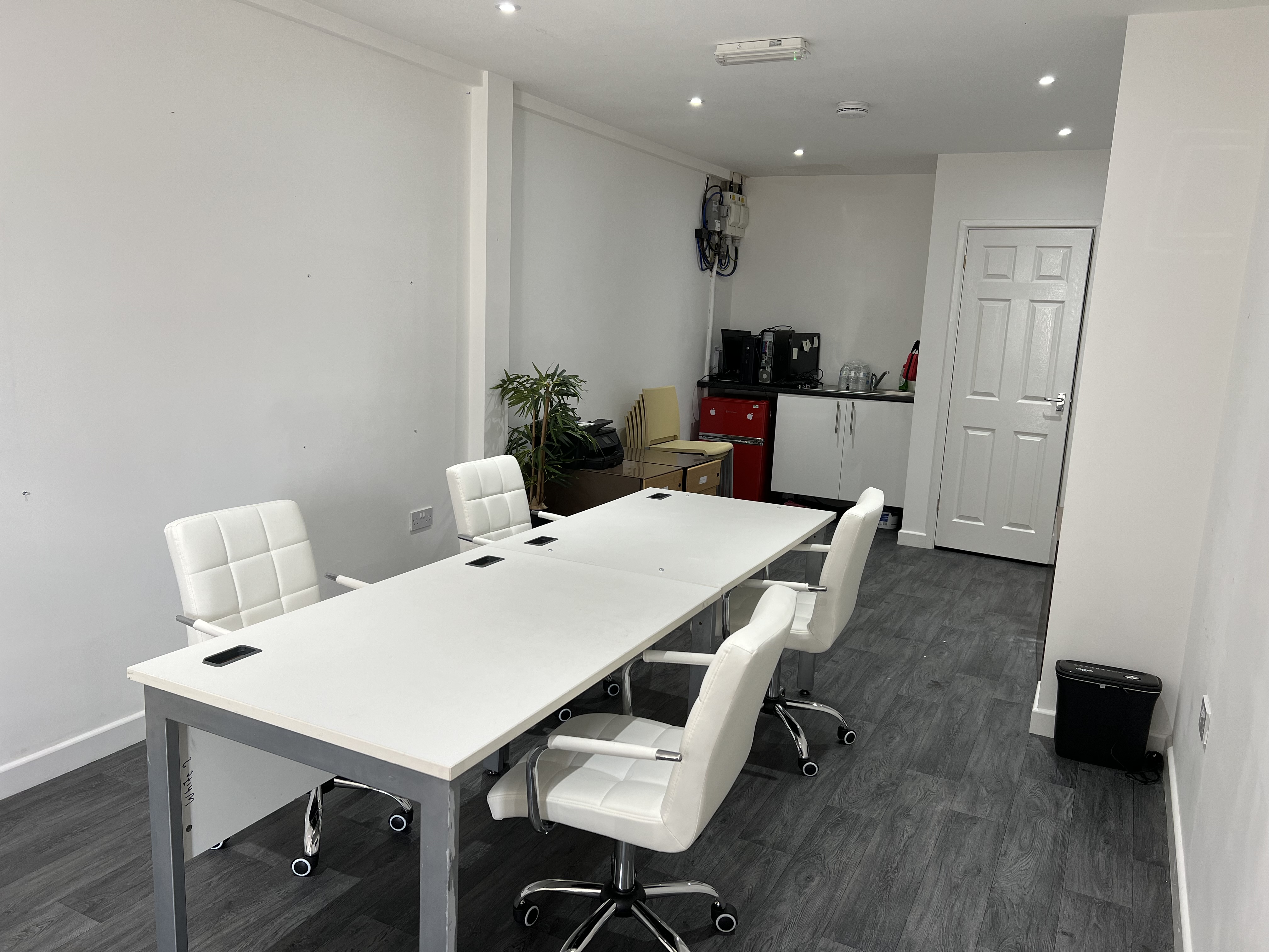 Modern meeting room in Strood ME2 with sleek table, ideal for events and collaboration.