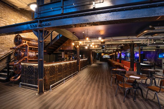 Recording studio event space with exposed brick, ideal for networking and gatherings.