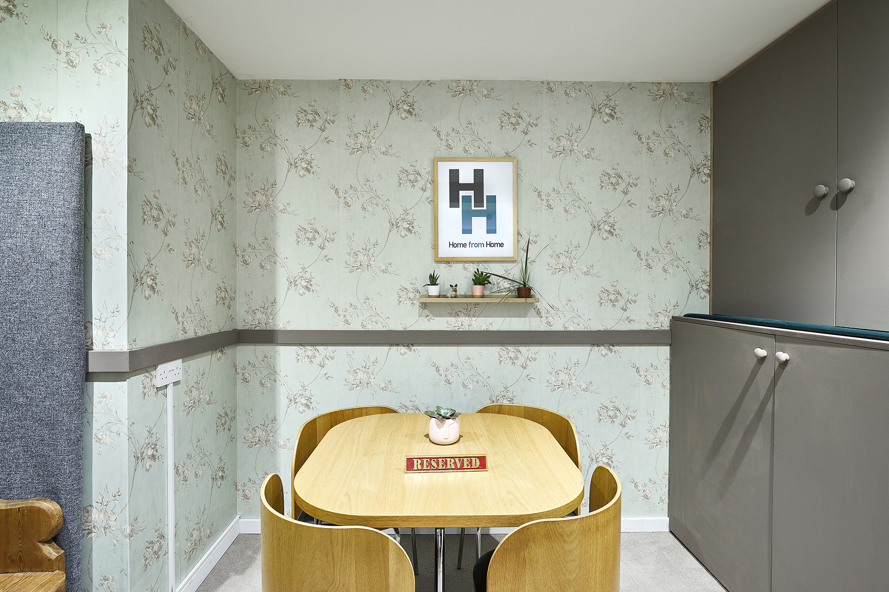 Cozy meeting space at Hatcham House with floral wallpaper for brainstorming sessions.