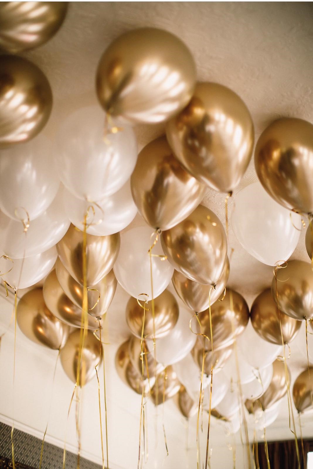Elegant gold and white balloon decor in Princess Room for weddings and corporate events.