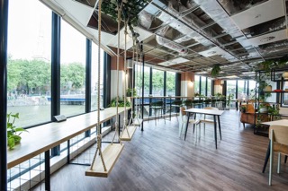 Modern event space with swing seating and natural light in Runway East Bristol.