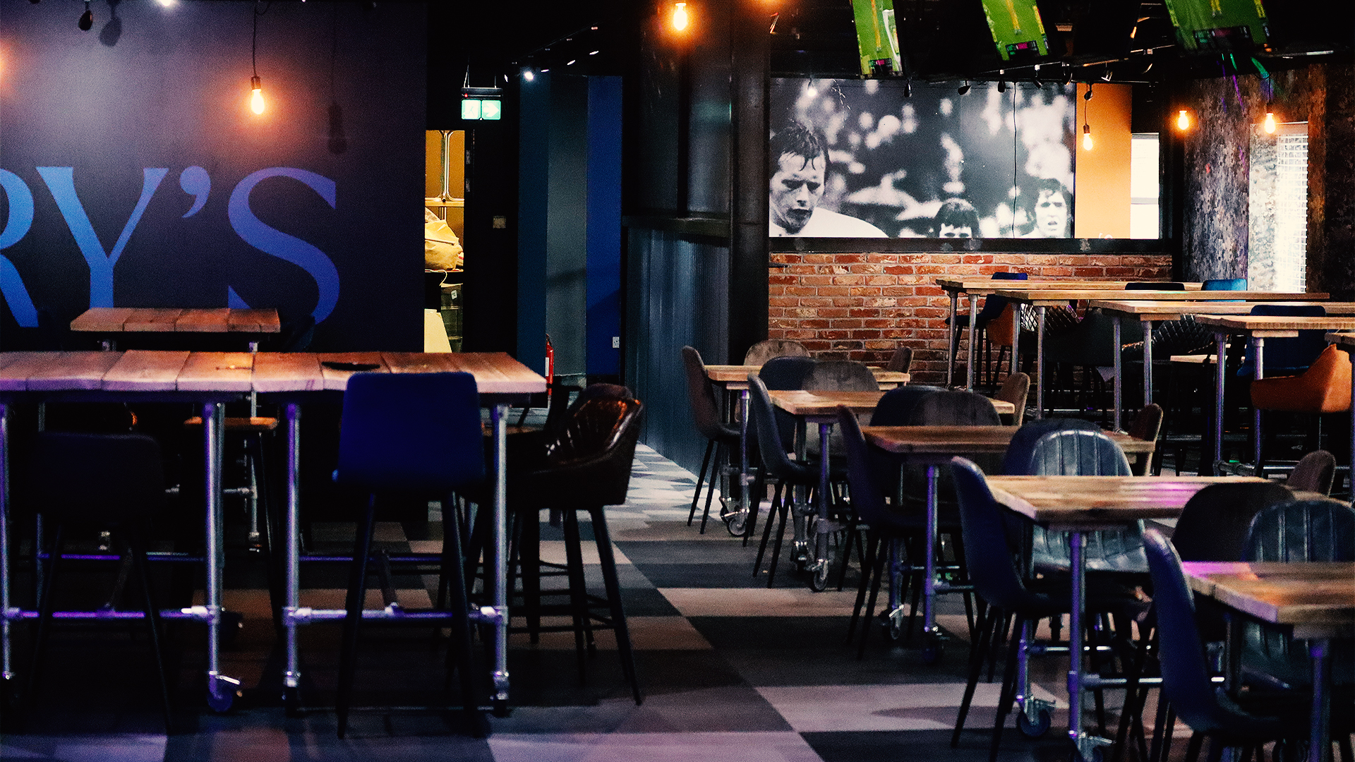 Arry's Bar event space with exposed brick, ideal for corporate and social gatherings.