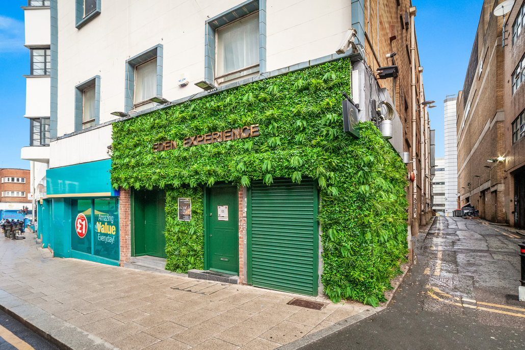 Gihon Suite venue with vibrant green facade for eco-friendly events and gatherings.