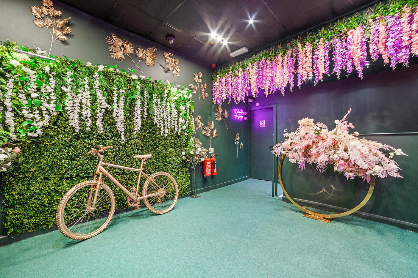 Gihon Suite event space with floral arch, perfect for intimate gatherings and themed events.