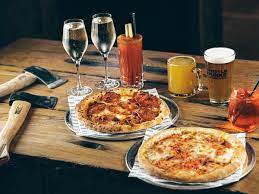 Vibrant venue hire for casual networking with rustic wooden table and craft beers.