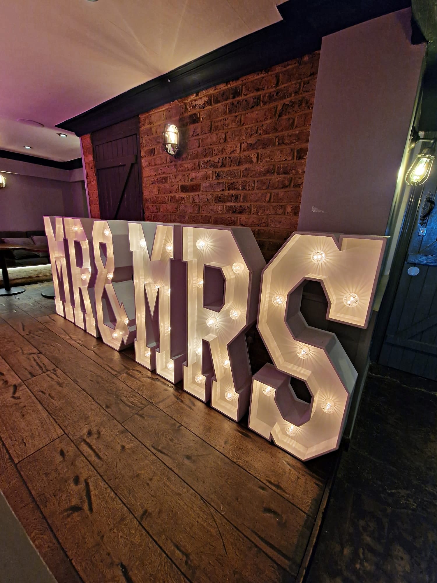 "MR & MRS light-up sign in Garden room, perfect for weddings and events decor."