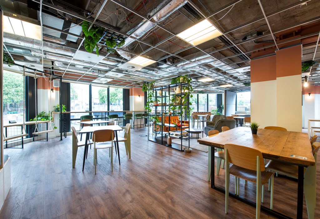 Steven in a modern event space with natural light, ideal for meetings and networking.