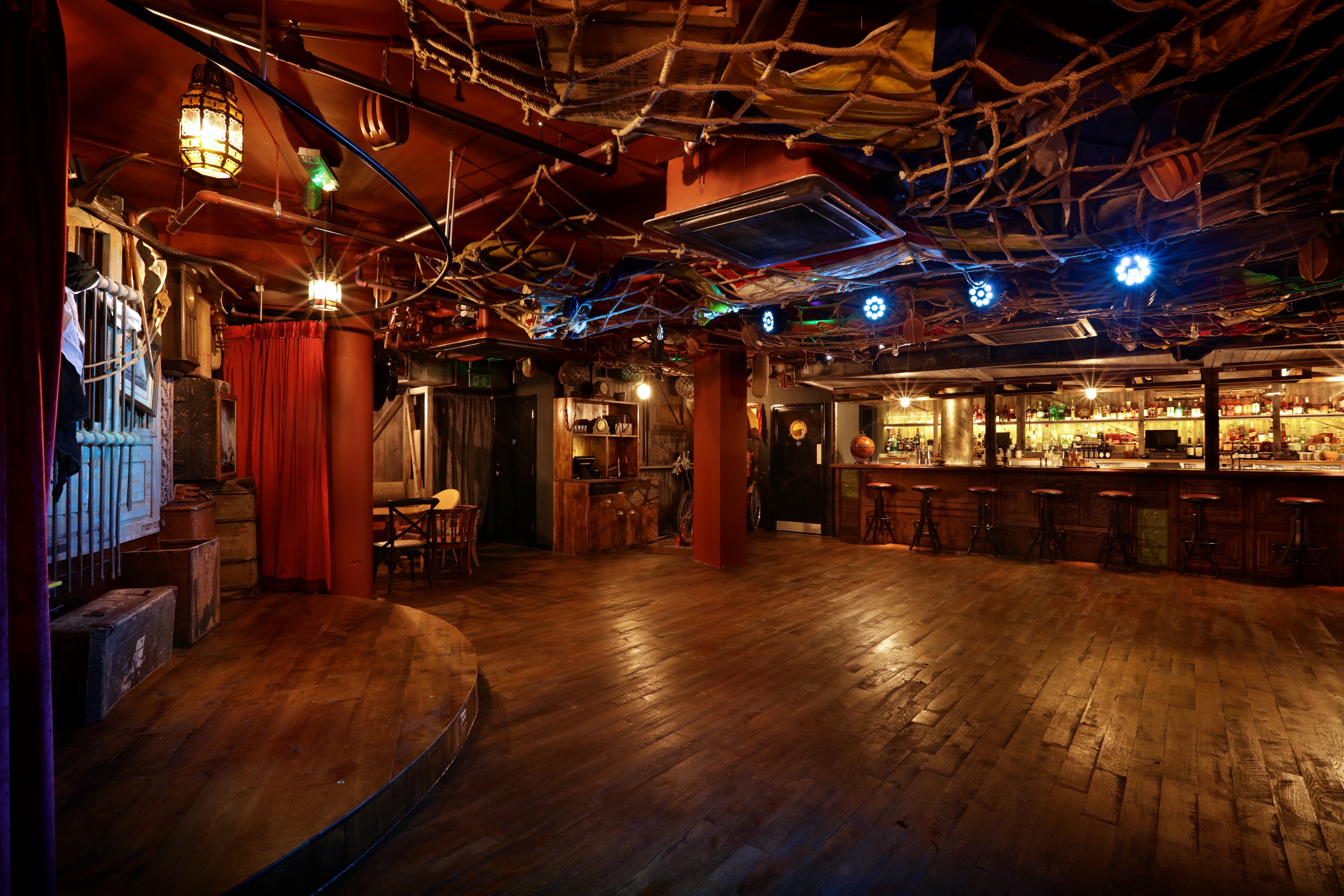 Rustic event space with wooden floors at Mr Fogg's City Tavern for gatherings and celebrations.
