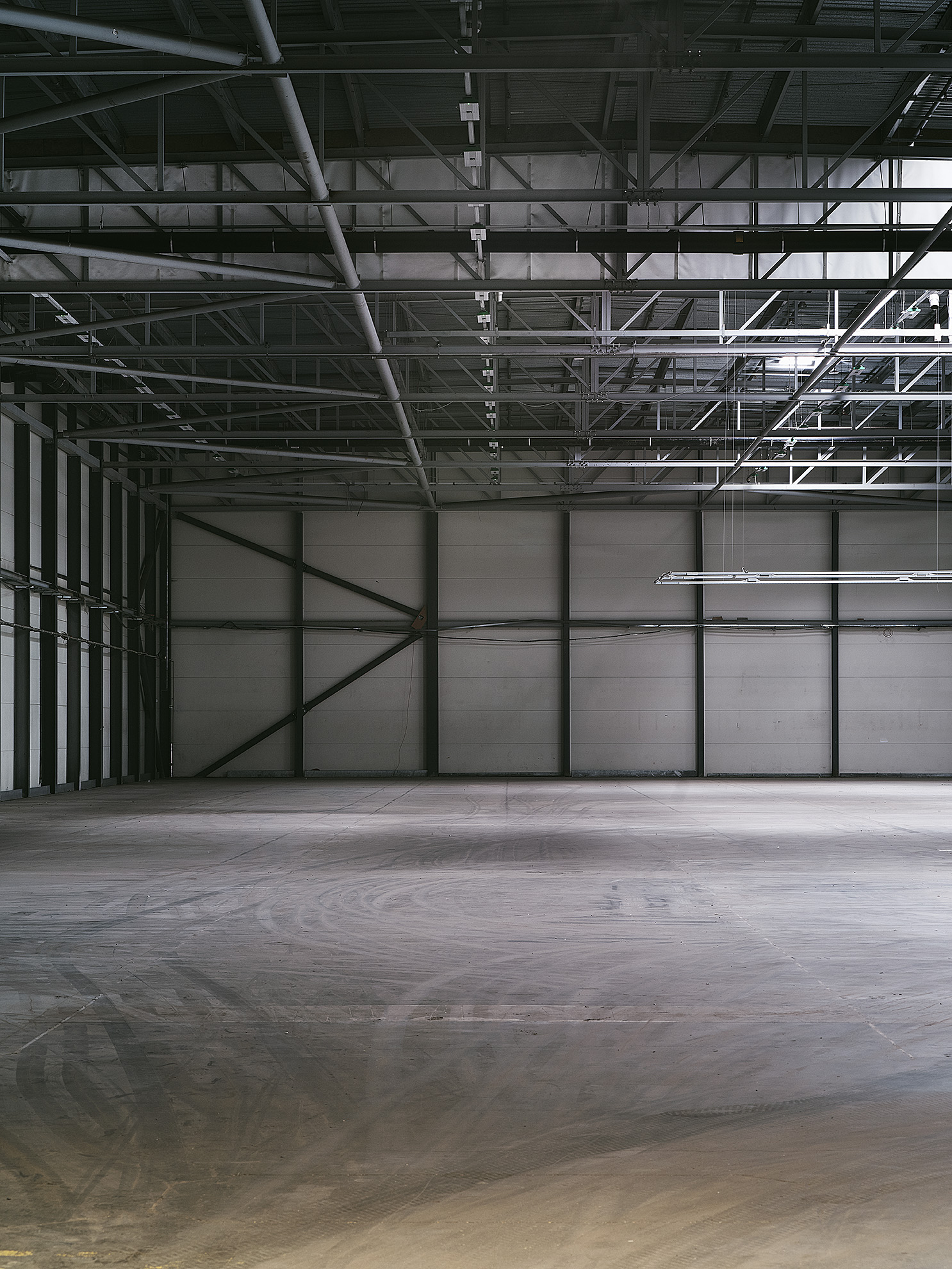 Spacious industrial venue with high ceilings for versatile events at Drumsheds.