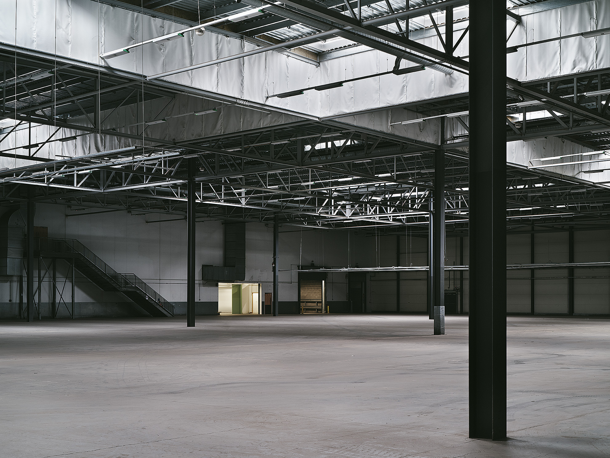 Spacious industrial venue with high ceilings for events at Drumsheds, London.