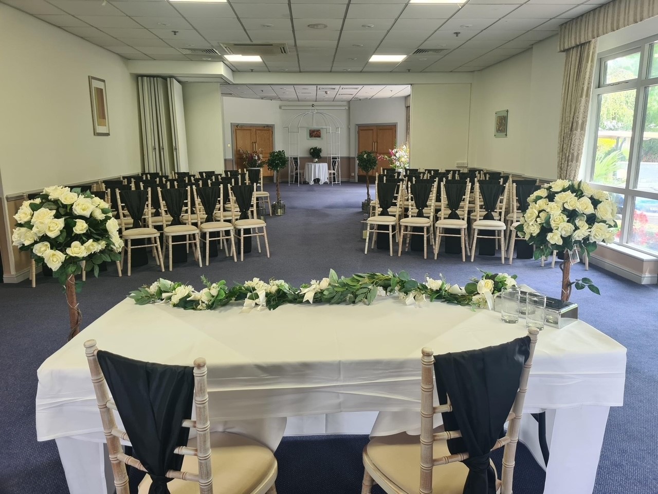 Elegant event space at Meon Valley Hotel with floral decor for weddings and corporate events.