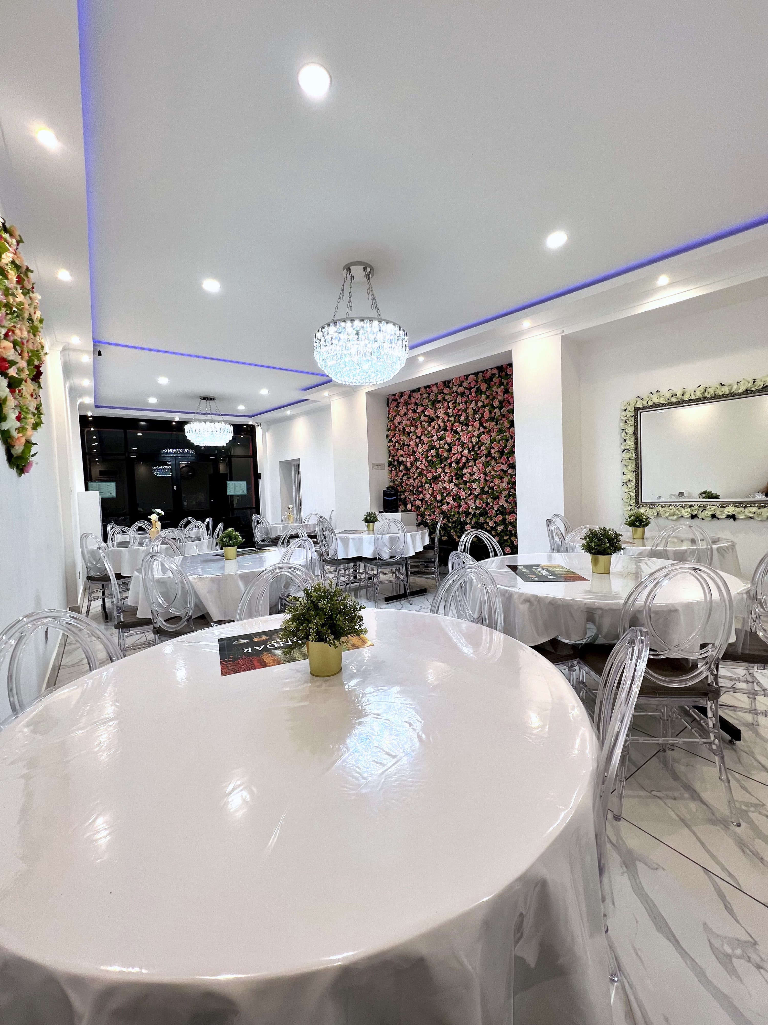 Elegant Watandar Hall with round tables, ideal for corporate events and gatherings.