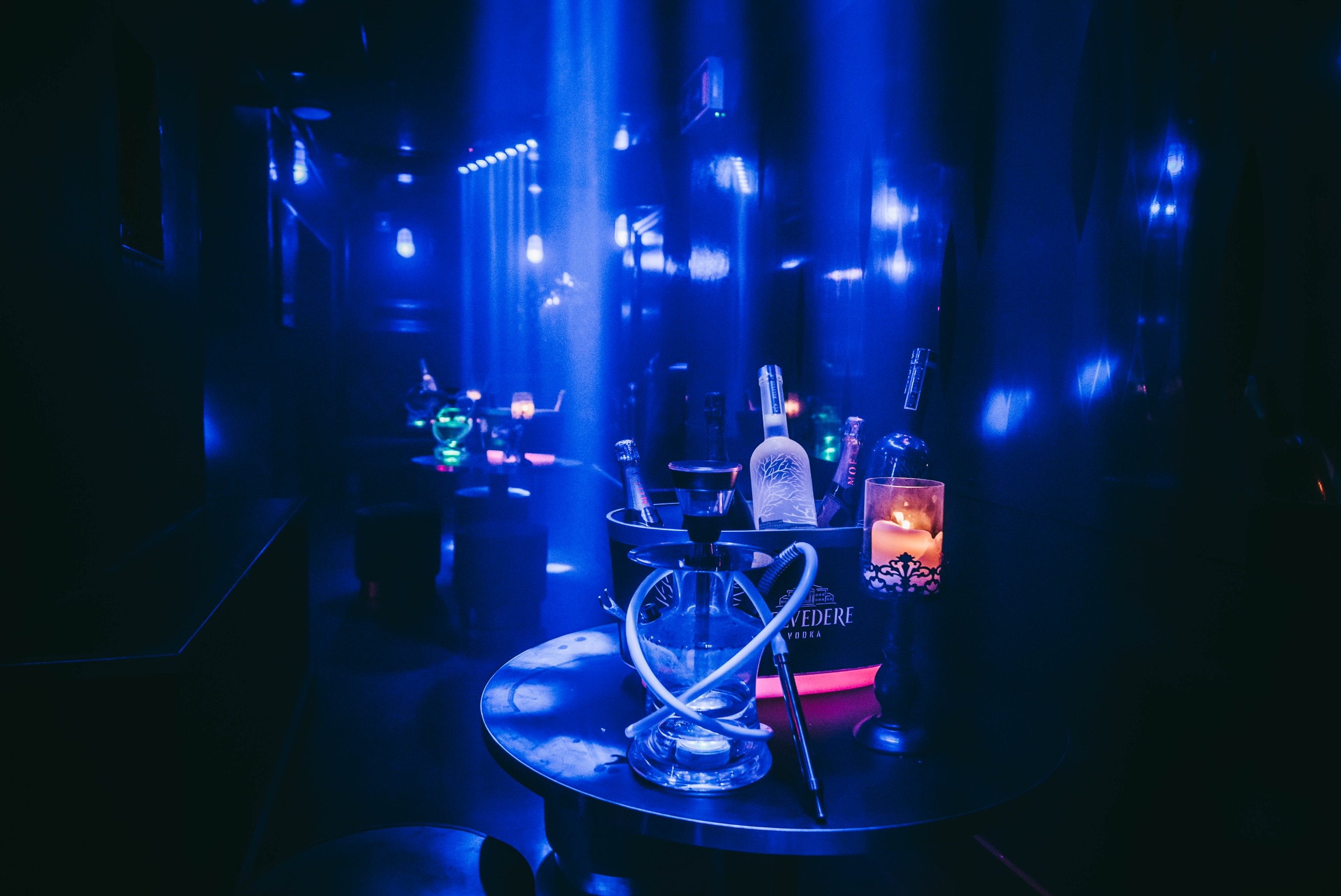 Stylish event space in Club Royale London with blue lighting for cocktail receptions.