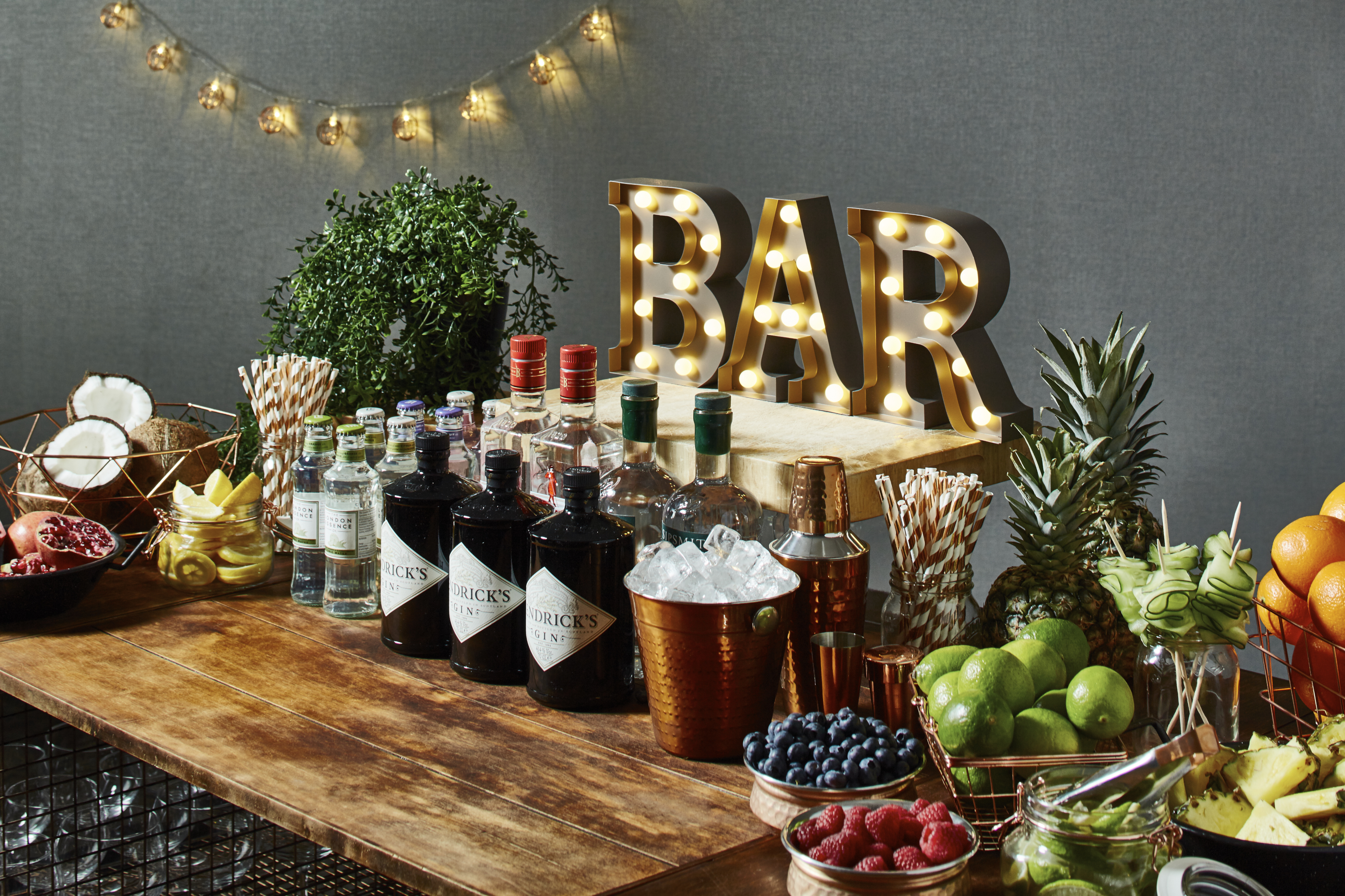 Worsley Suite bar setup with spirits and fruits, ideal for events and networking.